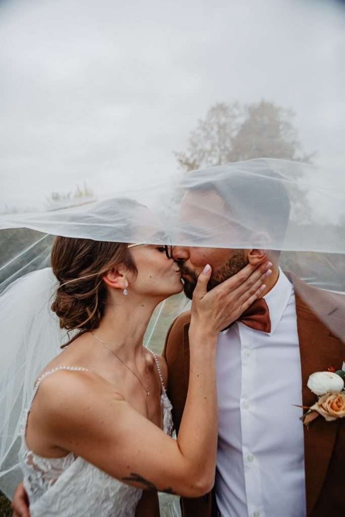 outdoor ceremony winnipeg wedding autumn couple kissing so cute