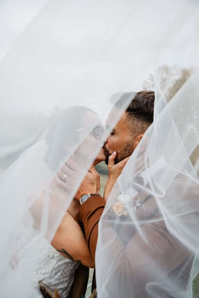 outdoor ceremony winnipeg wedding autumn couple kissing so cute